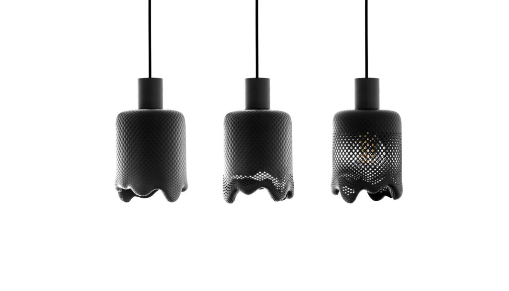 3d printed pendant light black with structures, fluid white background, photography